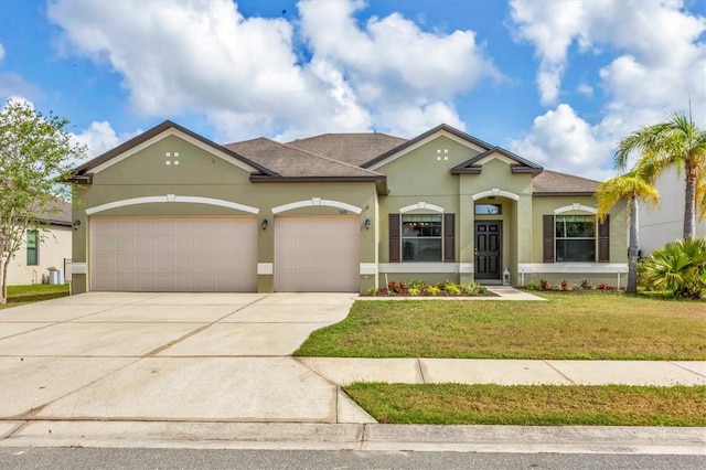 7418 61st St E, Palmetto, FL 34221 - mediterranean / spanish-style home featuring a front yard, roof with shingles, stucco siding, an attached garage, and driveway
