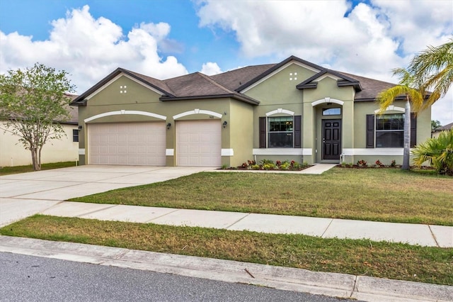 7418 61st St E, Palmetto, FL 34221 - view of front of house featuring driveway, a front lawn, an attached garage, a shingled roof, and stucco siding