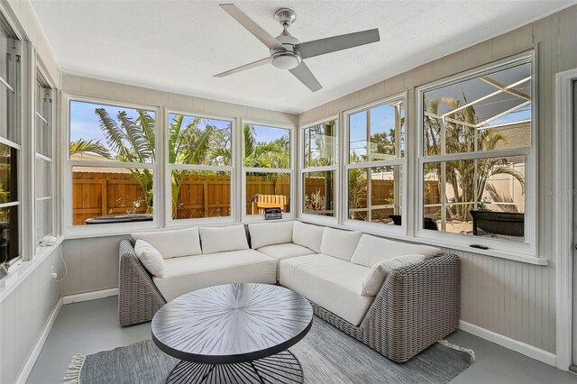 1112 65th St NW, Bradenton, FL 34209 - sunroom with a healthy amount of sunlight, baseboards, a ceiling fan, and an outdoor hangout area