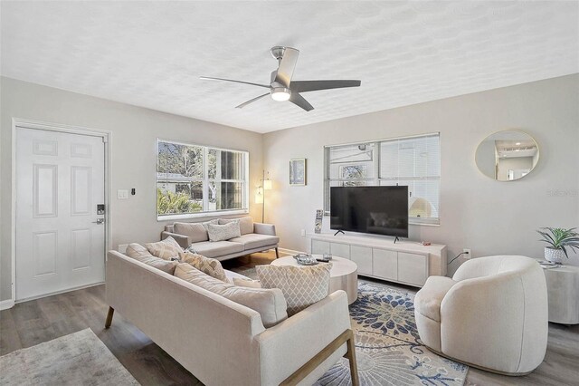 1112 65th St NW, Bradenton, FL 34209 - living area featuring a ceiling fan, baseboards, and wood finished floors