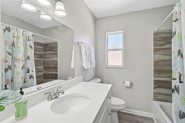 1112 65th St NW, Bradenton, FL 34209 - full bathroom featuring vanity, toilet, shower / bath combination with curtain, baseboards, and wood finished floors