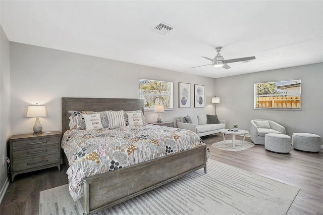 1112 65th St NW, Bradenton, FL 34209 - bedroom with baseboards, a ceiling fan, wood finished floors, and visible vents