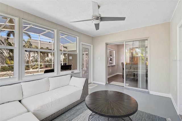1112 65th St NW, Bradenton, FL 34209 - sunroom / solarium with baseboards, a textured ceiling, and finished concrete flooring