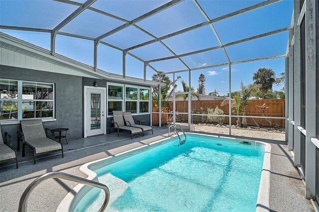 1112 65th St NW, Bradenton, FL 34209 - view of pool with a fenced in pool, a fenced backyard, glass enclosure, and a patio area