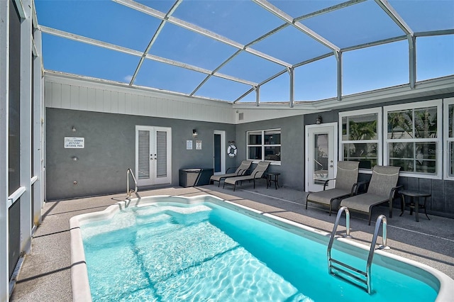 1112 65th St NW, Bradenton, FL 34209 - outdoor pool featuring glass enclosure and a patio area