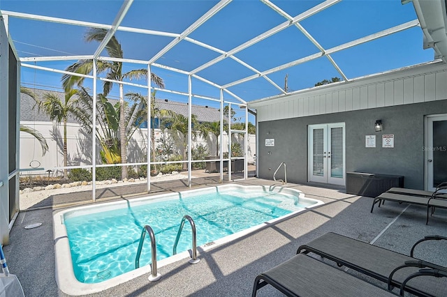 1112 65th St NW, Bradenton, FL 34209 - pool featuring a patio, a lanai, french doors, and cooling unit