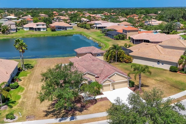 birds eye view of property featuring a water view and a residential view