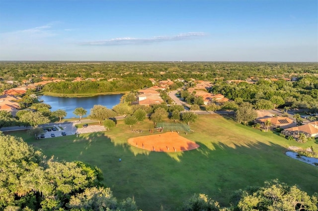 birds eye view of property with a water view and a residential view