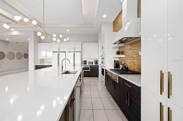 1514 Corolla Ct, Reunion, FL 34747 - kitchen with a sink, modern cabinets, stainless steel appliances, light countertops, and tasteful backsplash