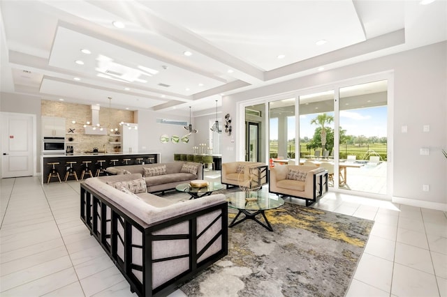 1514 Corolla Ct, Reunion, FL 34747 - living area featuring light tile patterned flooring, recessed lighting, a tray ceiling, and baseboards
