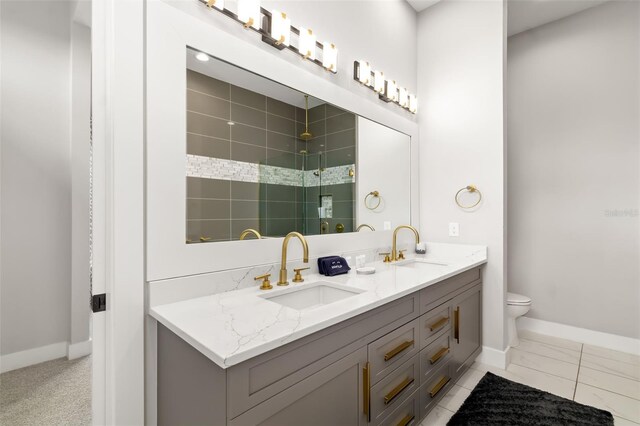 1514 Corolla Ct, Reunion, FL 34747 - full bath featuring a stall shower, baseboards, double vanity, and toilet