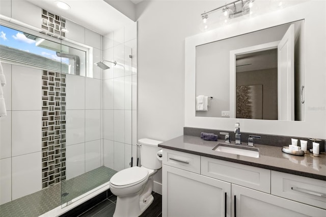 1514 Corolla Ct, Reunion, FL 34747 - bathroom featuring a stall shower, toilet, and vanity