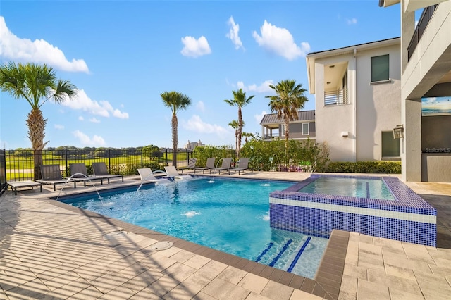 1514 Corolla Ct, Reunion, FL 34747 - view of swimming pool featuring fence, a patio area, and a pool with connected hot tub