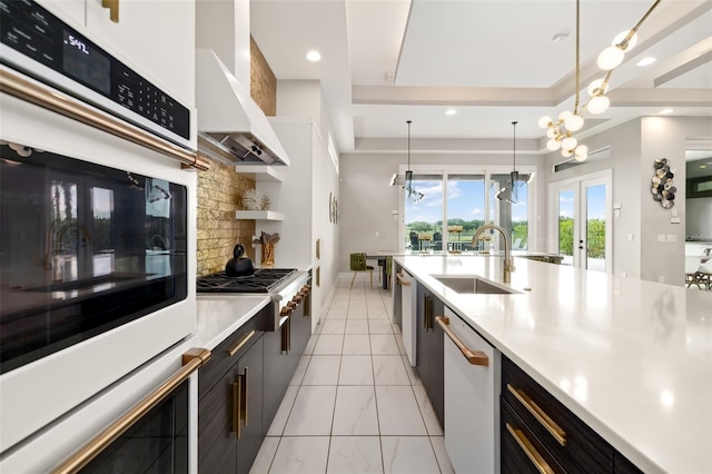 1514 Corolla Ct, Reunion, FL 34747 - kitchen featuring a sink, white appliances, light countertops, french doors, and hanging light fixtures