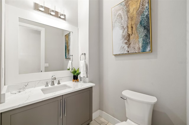 1514 Corolla Ct, Reunion, FL 34747 - bathroom featuring vanity, toilet, baseboards, and tile patterned flooring