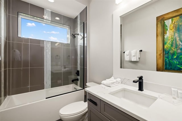 1514 Corolla Ct, Reunion, FL 34747 - bathroom featuring toilet, bath / shower combo with glass door, and vanity