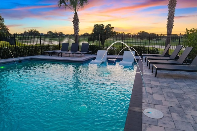 1514 Corolla Ct, Reunion, FL 34747 - pool at dusk with fence and a patio area