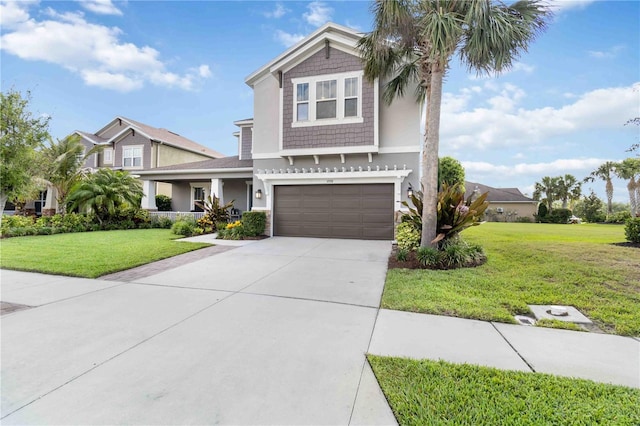 5978 Anise Dr, Sarasota, FL 34238 - view of front facade featuring a garage, stucco siding, concrete driveway, and a front yard