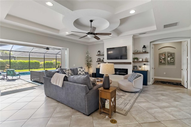 5978 Anise Dr, Sarasota, FL 34238 - living area featuring a ceiling fan, a sunroom, light tile patterned floors, a glass covered fireplace, and coffered ceiling