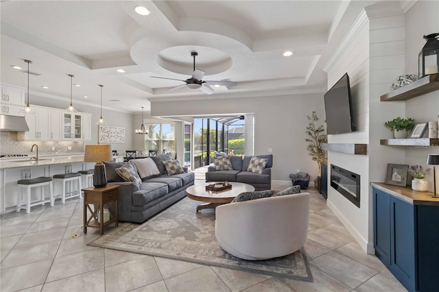 5978 Anise Dr, Sarasota, FL 34238 - living area featuring a large fireplace, a ceiling fan, coffered ceiling, and recessed lighting