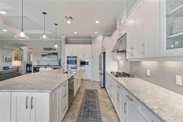 5978 Anise Dr, Sarasota, FL 34238 - kitchen featuring visible vents, crown molding, appliances with stainless steel finishes, a sink, and under cabinet range hood
