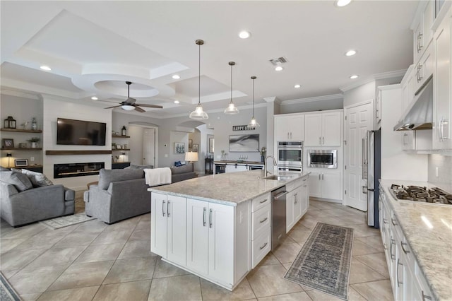5978 Anise Dr, Sarasota, FL 34238 - kitchen featuring a ceiling fan, visible vents, appliances with stainless steel finishes, ornamental molding, and under cabinet range hood