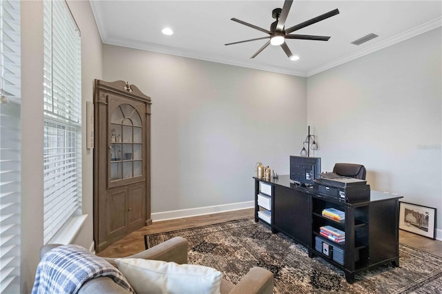 5978 Anise Dr, Sarasota, FL 34238 - home office with crown molding, a ceiling fan, baseboards, wood finished floors, and visible vents