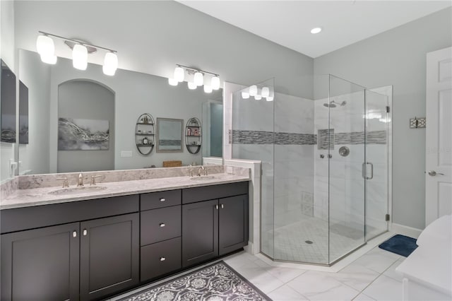 5978 Anise Dr, Sarasota, FL 34238 - bathroom featuring a sink, a stall shower, and double vanity