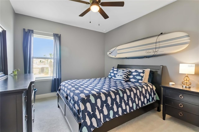 5978 Anise Dr, Sarasota, FL 34238 - carpeted bedroom with baseboards and ceiling fan