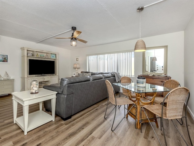 340 Base Ave E Unit 314, Venice, FL 34285 - dining area with a ceiling fan and light wood finished floors