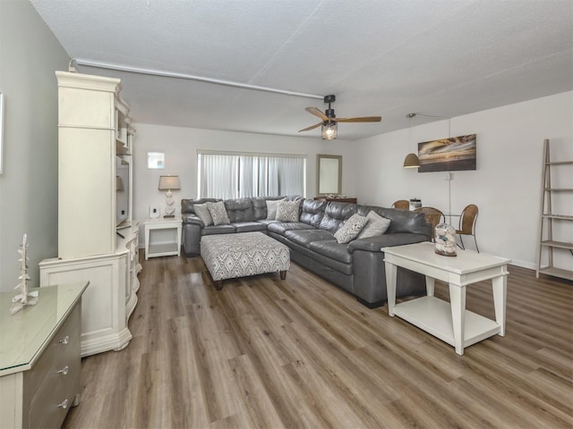 340 Base Ave E Unit 314, Venice, FL 34285 - living area with a ceiling fan and wood finished floors