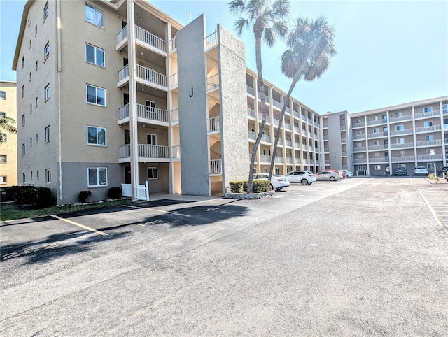 3559 Lake Bayshore Dr Unit J-204, Bradenton, FL 34205 - view of building exterior with uncovered parking