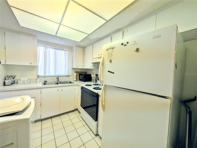 3559 Lake Bayshore Dr Unit J-204, Bradenton, FL 34205 - kitchen with white appliances, white cabinetry, under cabinet range hood, a sink, and light tile patterned floors