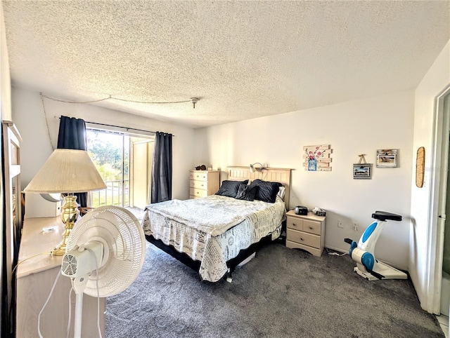 3559 Lake Bayshore Dr Unit J-204, Bradenton, FL 34205 - bedroom with a textured ceiling and dark carpet