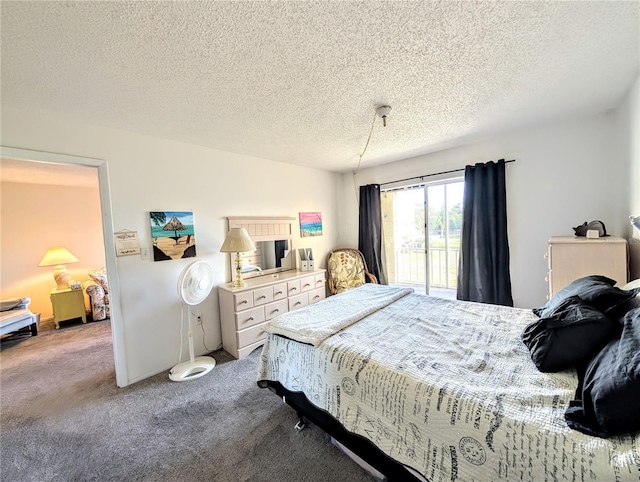 3559 Lake Bayshore Dr Unit J-204, Bradenton, FL 34205 - bedroom featuring a textured ceiling, carpet, and access to exterior
