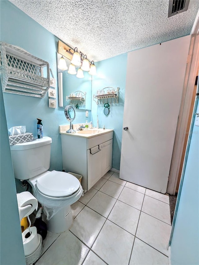 3559 Lake Bayshore Dr Unit J-204, Bradenton, FL 34205 - bathroom featuring toilet, a textured ceiling, and visible vents