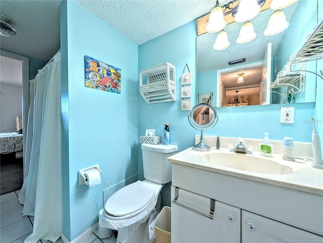 3559 Lake Bayshore Dr Unit J-204, Bradenton, FL 34205 - bathroom featuring vanity, toilet, ensuite bath, and a textured ceiling