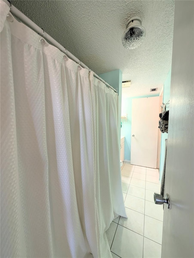 3559 Lake Bayshore Dr Unit J-204, Bradenton, FL 34205 - full bath with tile patterned flooring, a textured ceiling, and visible vents