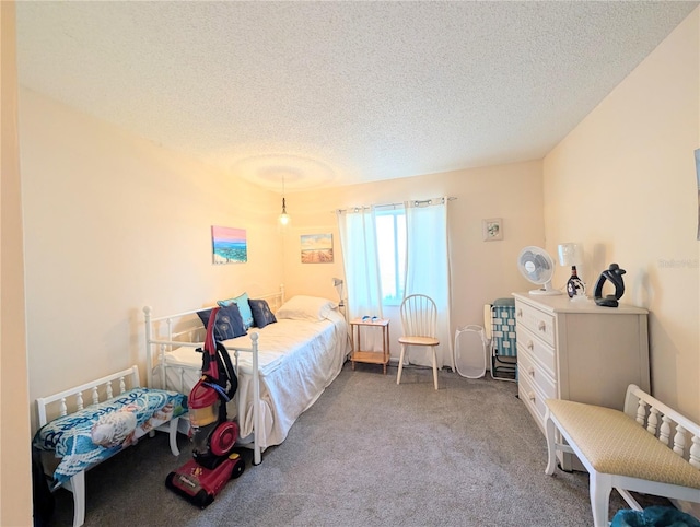 3559 Lake Bayshore Dr Unit J-204, Bradenton, FL 34205 - bedroom featuring a textured ceiling and carpet