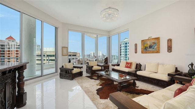living room with a city view, tile patterned flooring, and a chandelier