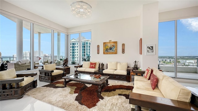 living area with plenty of natural light, a city view, and a chandelier
