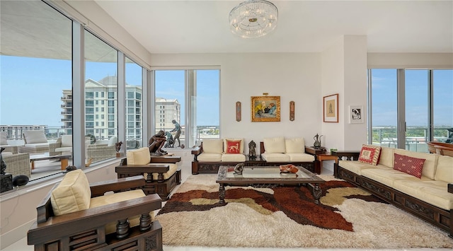 living room featuring plenty of natural light and a chandelier