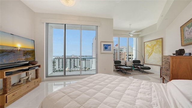 tiled bedroom featuring access to exterior and a city view