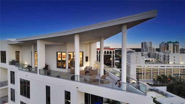 view of patio featuring a balcony