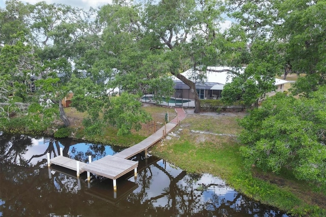 dock area with a water view and an outdoor pool