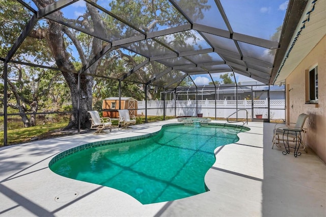 view of swimming pool featuring a storage shed, a patio, and a fenced backyard