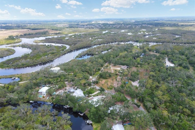 aerial view of property and surrounding area with a large body of water