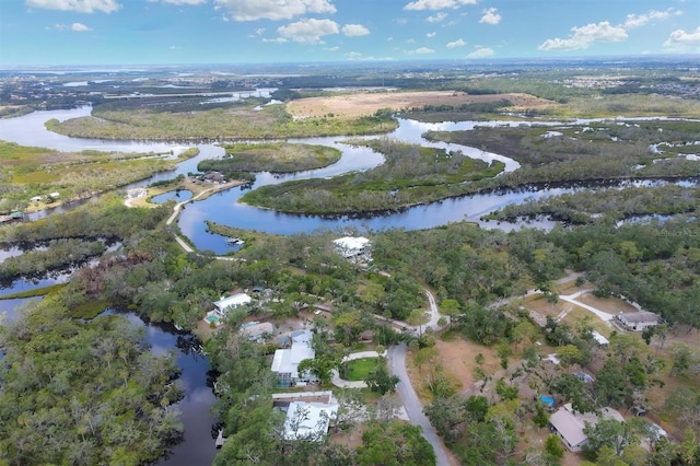 aerial view of property's location with a nearby body of water
