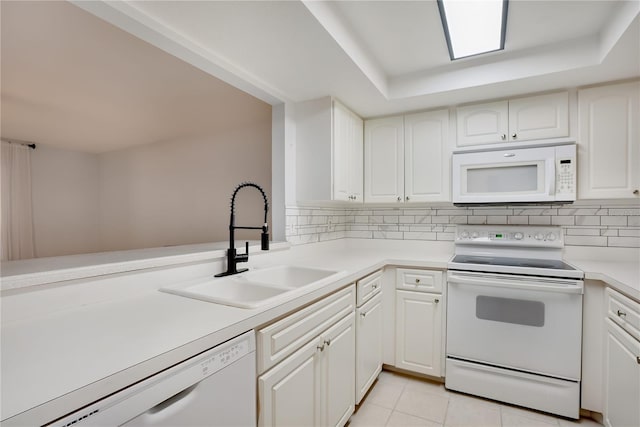 kitchen featuring a sink, white cabinetry, white appliances, and light countertops