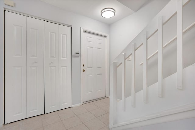 foyer entrance featuring light tile patterned floors